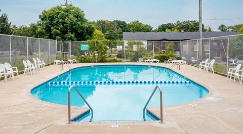 A rectangular pool with a metal ladder on each side.