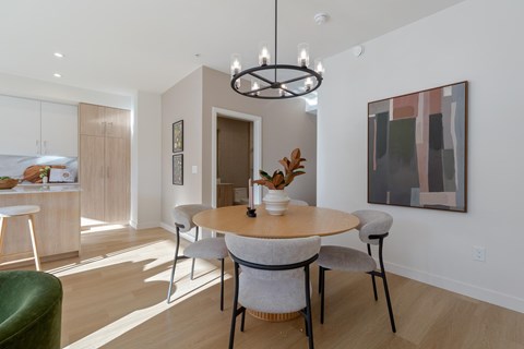 Image of a modern dining room with a round table and chairs in Hillcrest Ave located in Abbotsford, BC