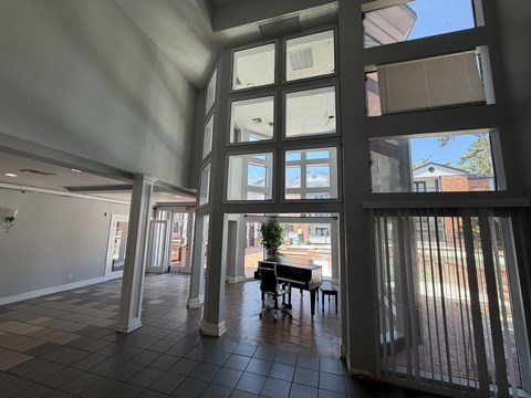 A view of a patio with a table and chairs located at Canfield Lakes Apartments in Houston TX