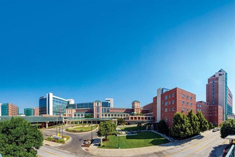 A hospital complex with a mix of modern and older buildings.