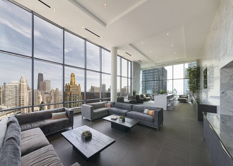 A modern living room with a view of the city skyline.