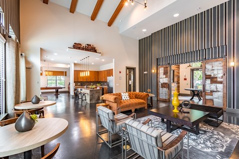 a living room with couches and chairs and a table