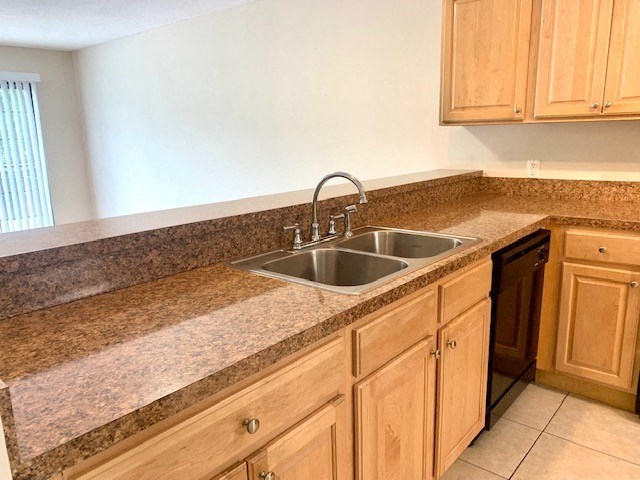 a kitchen with a sink and a dishwasher