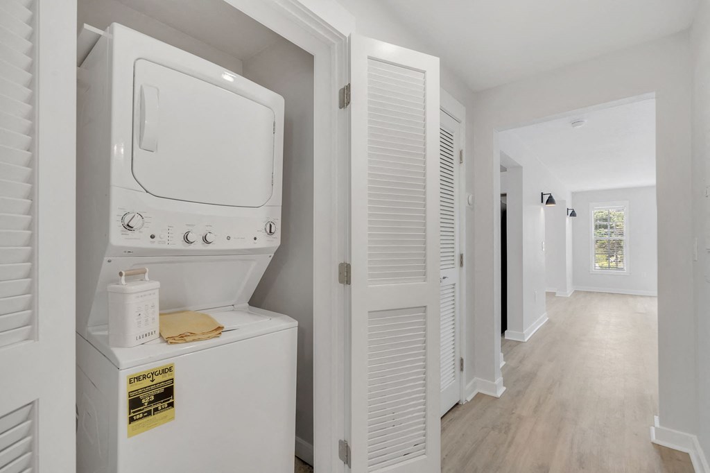 a laundry room with a washer and dryer in a 555 waverly unit