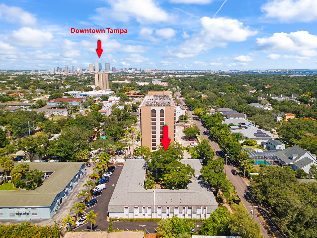an aerial view of the building with two red arrows pointing to it