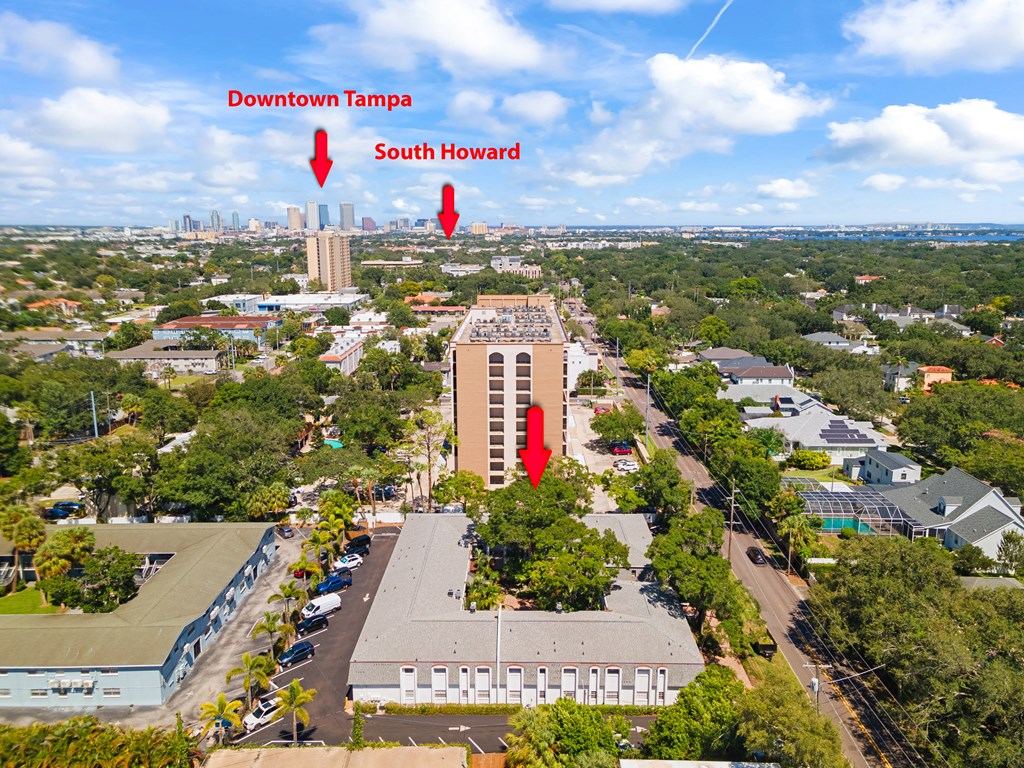 an aerial view of the building with two red arrows pointing to the south and north elevators
