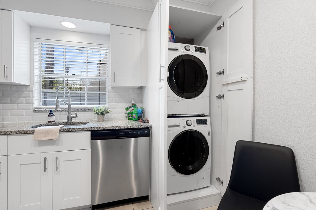 a small laundry room with a washer and dryer