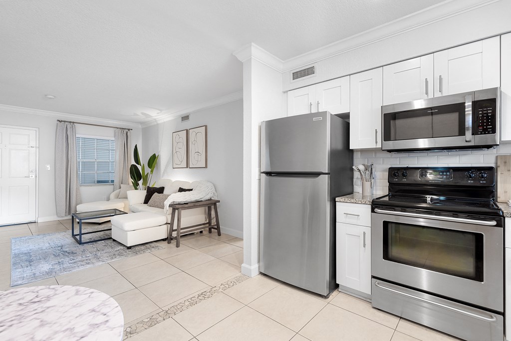a kitchen and living room in a 555 waverly unit