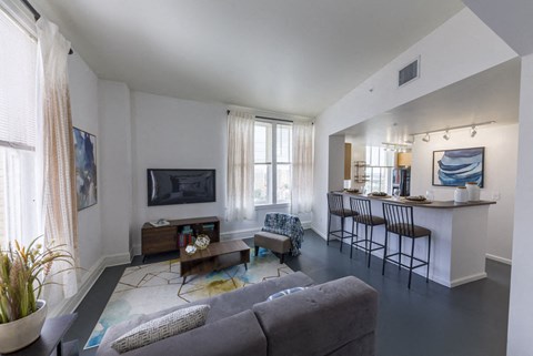 a living room with a couch and a table