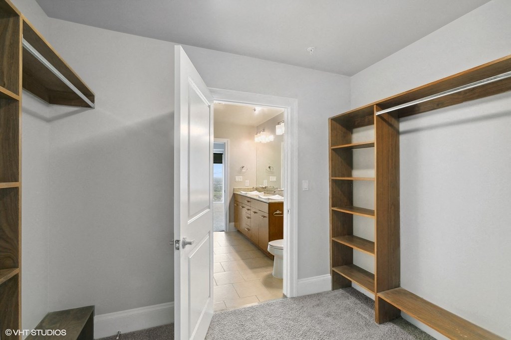 Allure Hermann Park spacious walk-in closet offering generous storage in Houston, TX