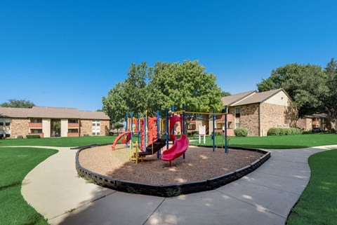 The Park at Wintergreen Apartments | DeSoto, TX | Playground and Jogging Path