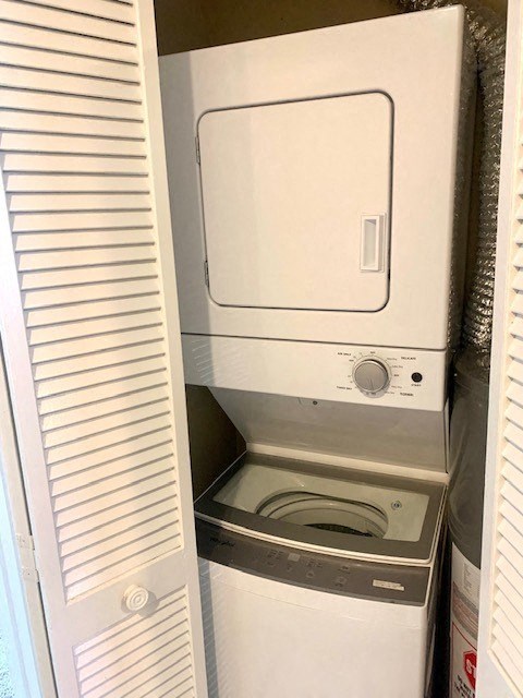a washer and dryer are in a closet