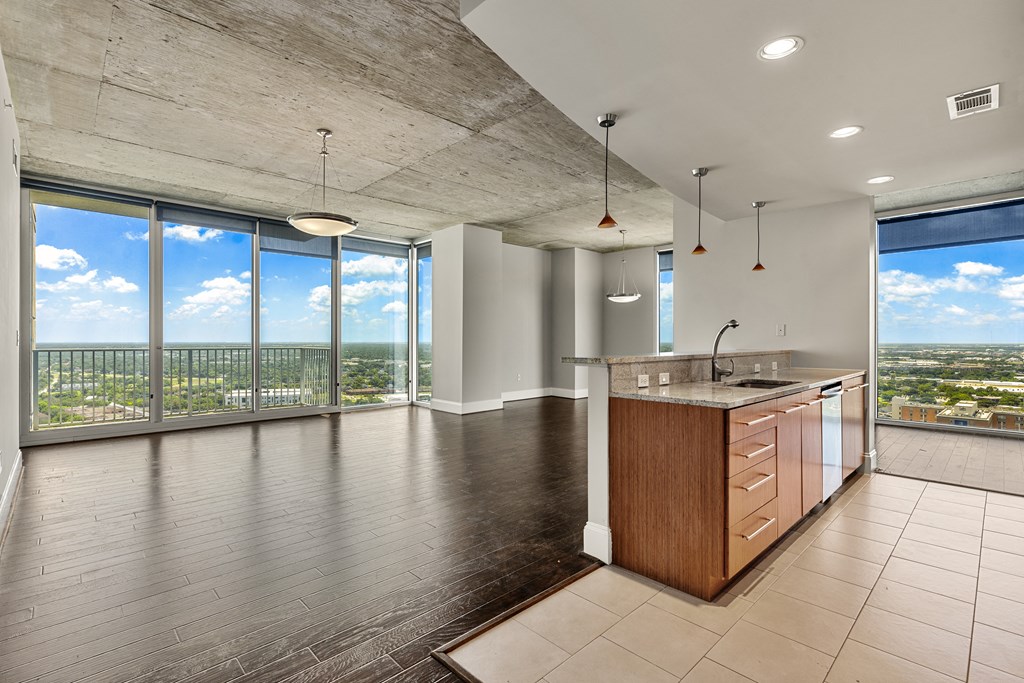 Allure Hermann Park | Penthouse Kitchen & Living Area