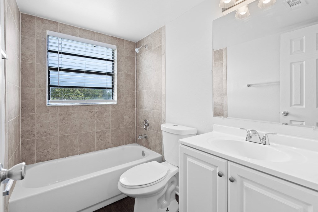 a bathroom with a bathtub toilet and sink