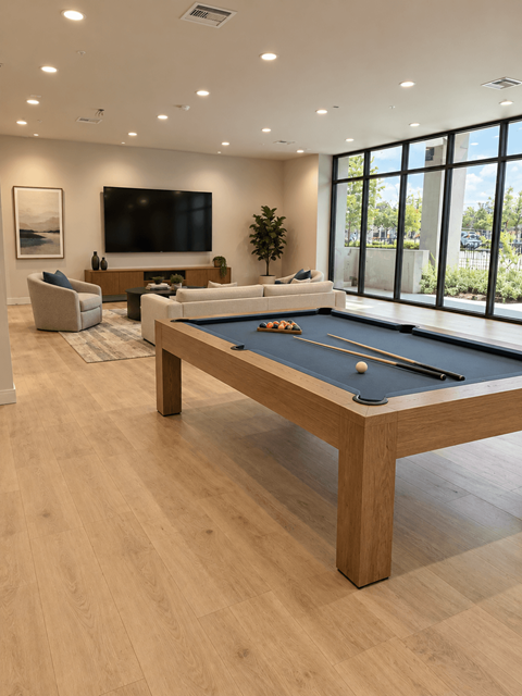 A pool table in community center at Ambar Station Apartments, Florida