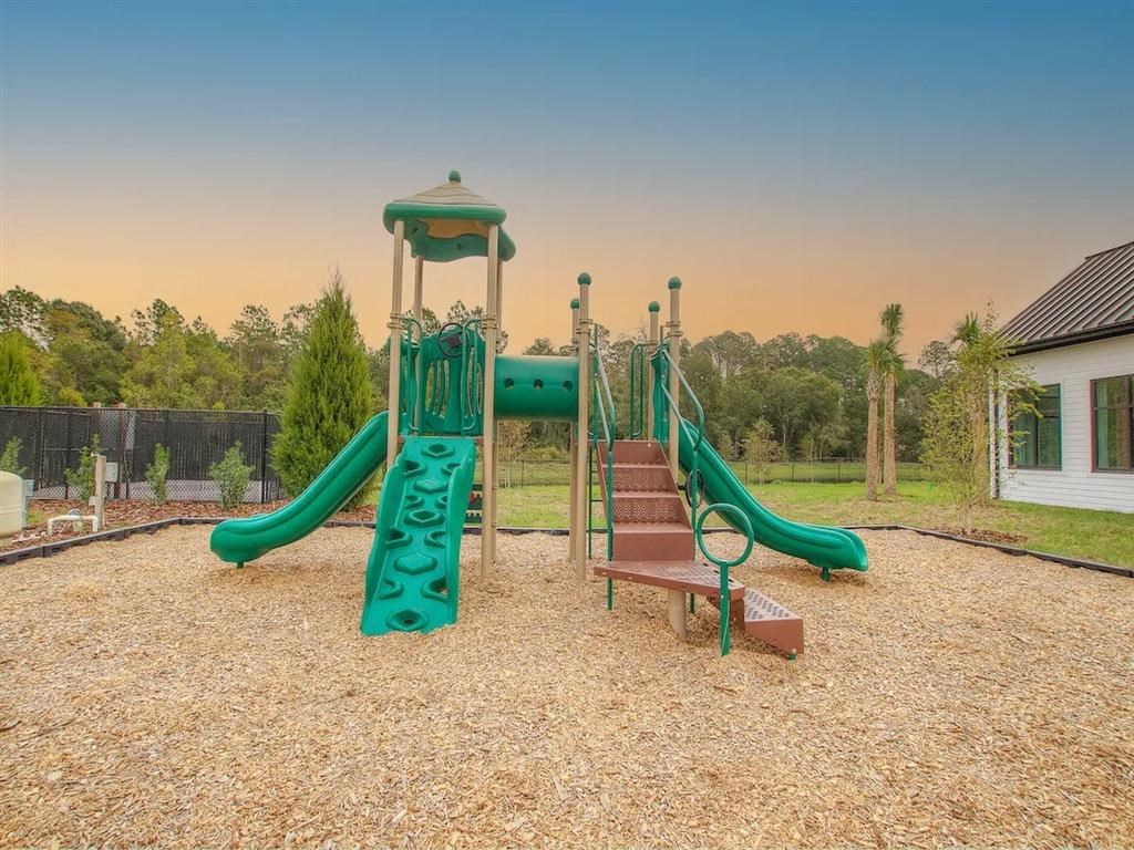 a playground with slides and a swing set