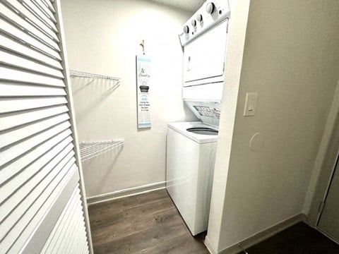 a small kitchen with a stove and a refrigerator