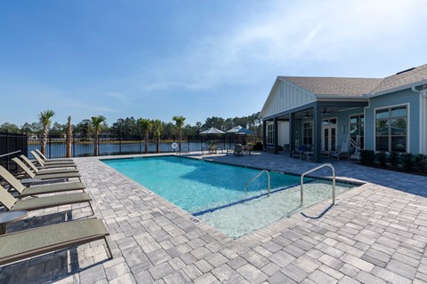 our resort style swimming pool is in front of our house and is next to a