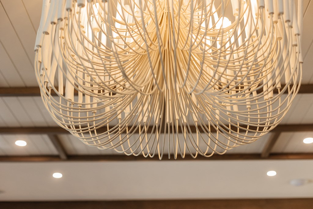 a large wooden chandelier hangs from the ceiling