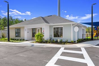 a white building with a stop sign in front of it