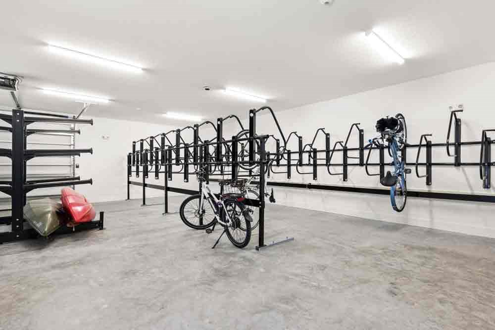 Wall of bikes on display inside a store, showcasing various models and colors for sale in Florida