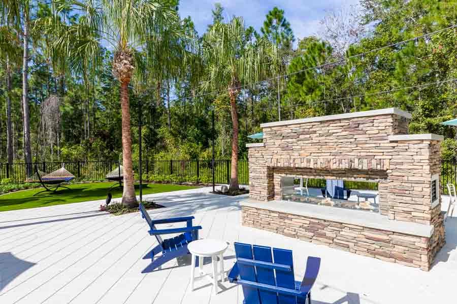 Cozy outdoor fireplace at Longleaf at St. Johns, St. Johns, FL, perfect for gatherings