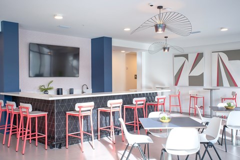 Modern resident lounge with bar seating at Ambar Trail Apartments, Homestead