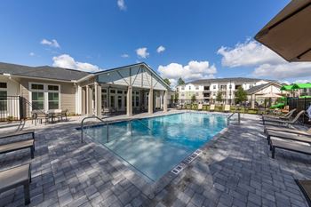 a swimming pool with a building in the background