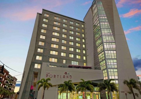 The Portland hotel is a large building with a modern design.