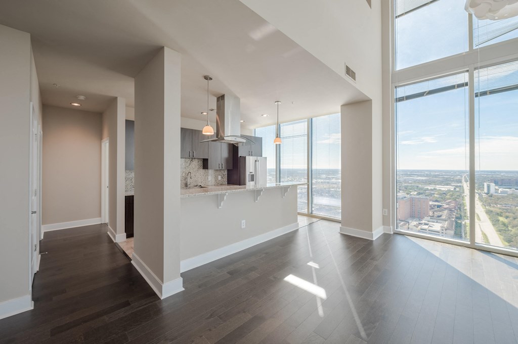 Allure Hermann Park | Penthouse Apartment Kitchen & Living Room