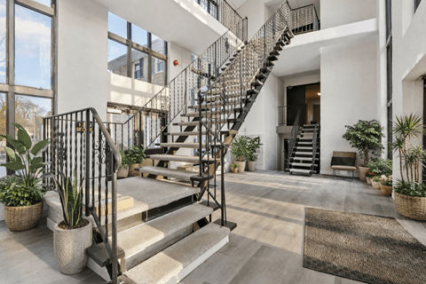A modern house with a staircase and plants.