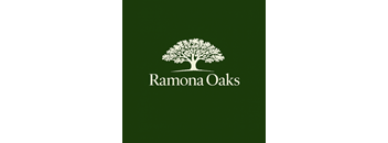 A logo with a tree and the text "Ramona Oaks" on a green background.