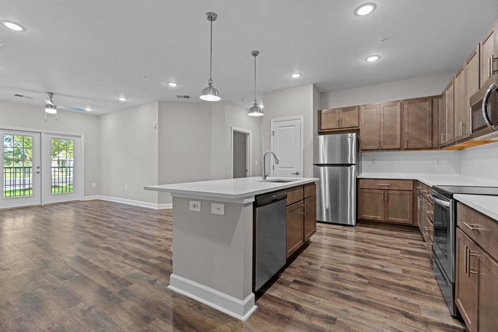 a kitchen with an island in the middle of it