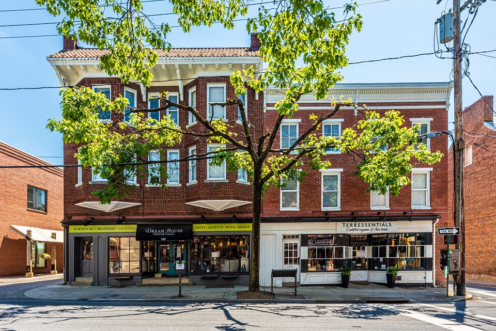 a brick building with a tree in front of it