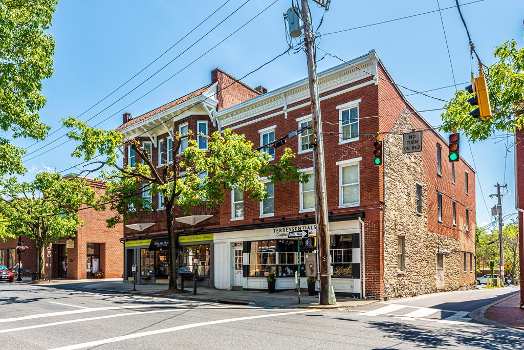 a brick building on the corner of a city street