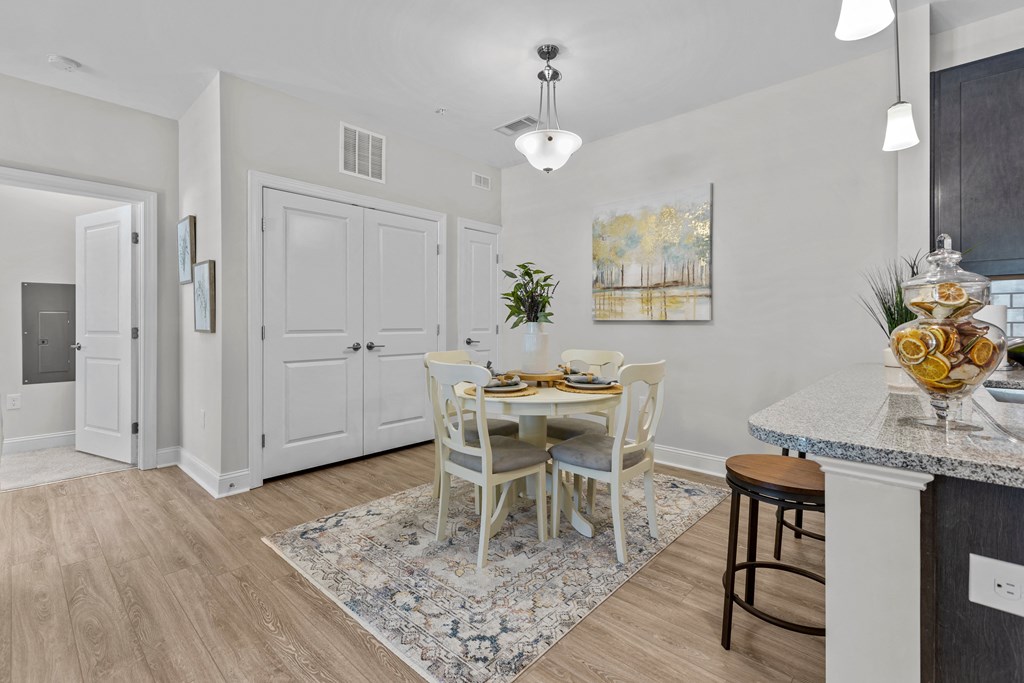 an open kitchen and dining room with a table and chairs
