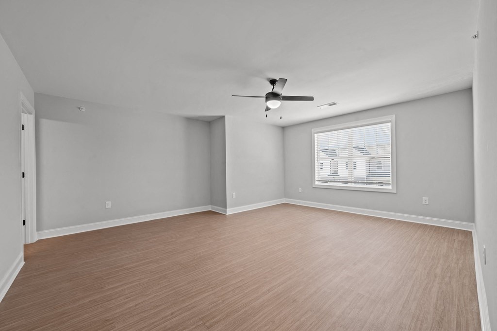 A room with a ceiling fan and a window with blinds.at Regency Townes, North Carolina, 28590