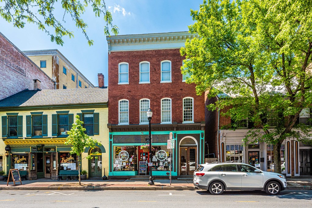a car parked in front of a building on a city street