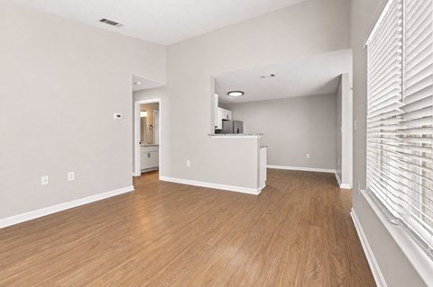 A room with wooden floors and white walls.