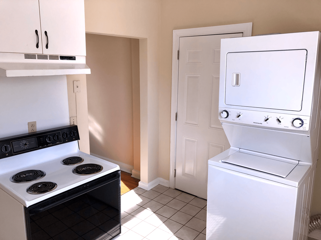 a kitchen with a stove and a refrigerator