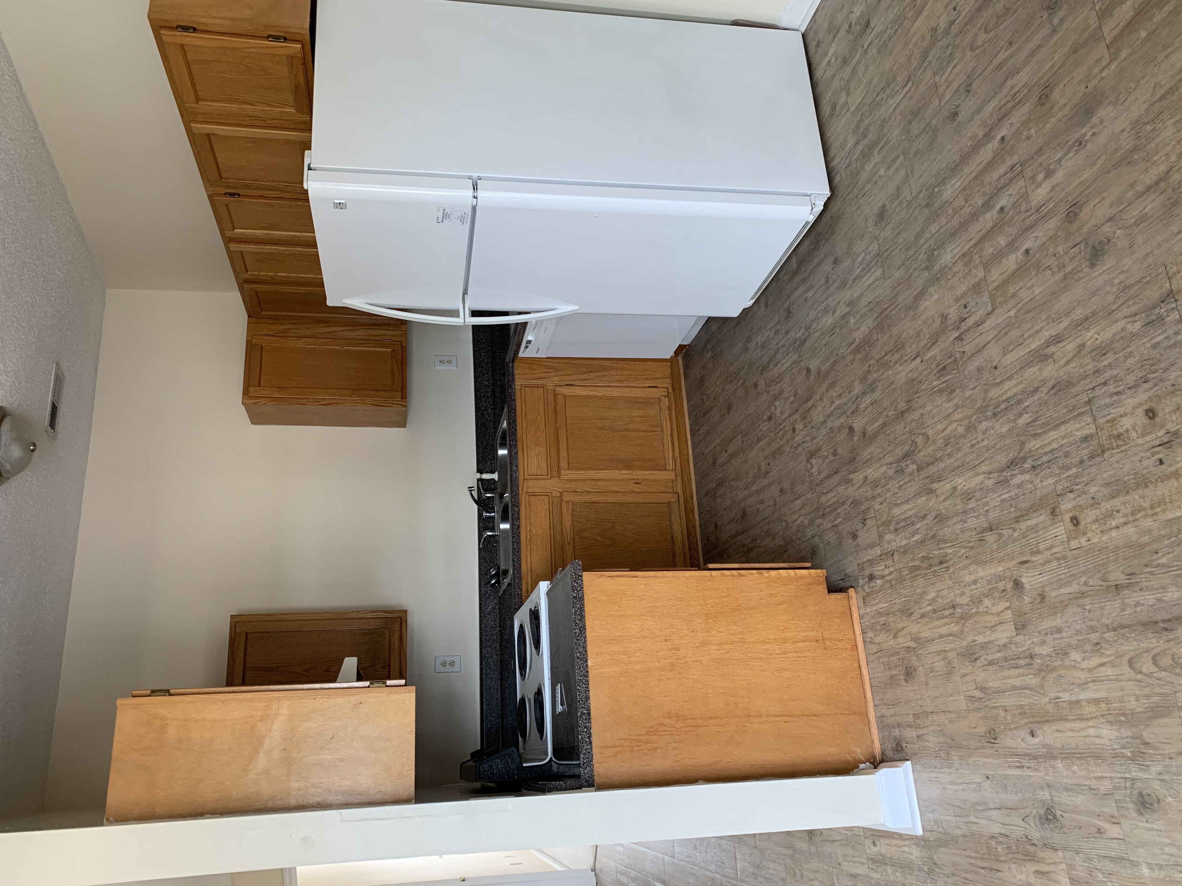 a view from the bottom of a staircase with wooden boxes on it