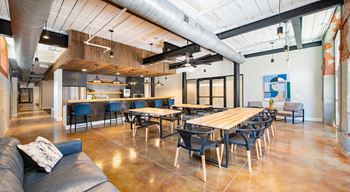 A large conference room with a long table and chairs at Judson Mill Lofts, South Carolina 29611