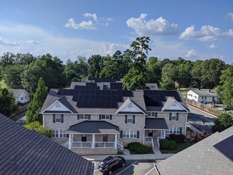 a house with solar panels on the roof