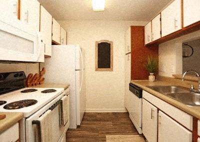 A kitchen with white appliances and wooden cabinets.