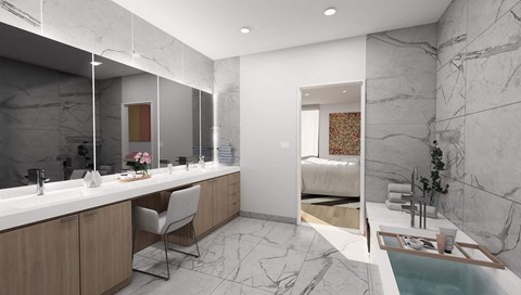 a bathroom with a sink and a mirror and a bed