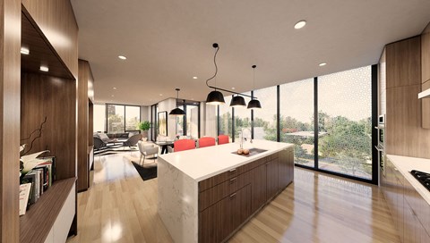a kitchen with a white counter top and a large window