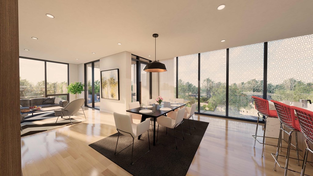a dining room and living room with a table and chairs