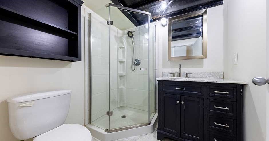 a bathroom with a toilet sink and a shower