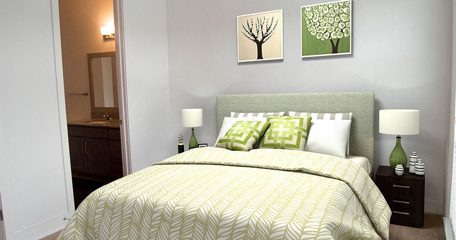 a bedroom with a bed and two paintings on the wall