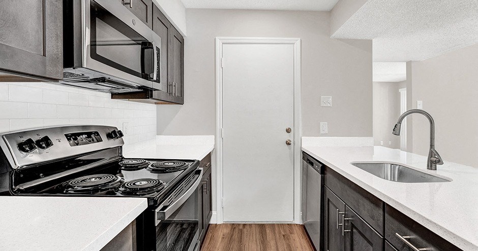 a kitchen with a stove and a sink